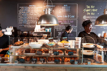 Freshly cooked dishes are presented at one of the locations of the Instock restaurant.