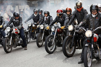 Members of motorcycle clubs ride together in large groups showing off their bikes
