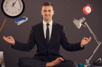 Businessman meditating desk office mindfulness