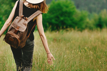 Woman walking outdoors to show intrinsic motivation