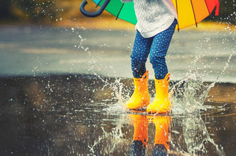 Splashing in the rain waiting for the colors to appear.