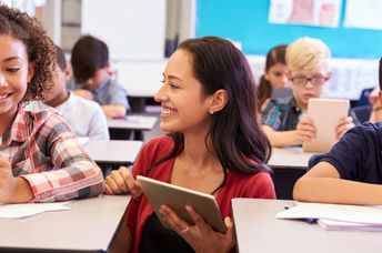 kids in a classroom on tablets