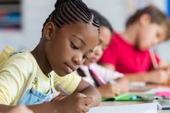 Pupils learning in a classroom
