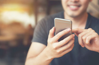 Man intrigued by his smartphone