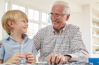 Grandfather playing with grandson