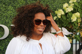 Oprah Winfrey gives college scholarships to four deserving young men.