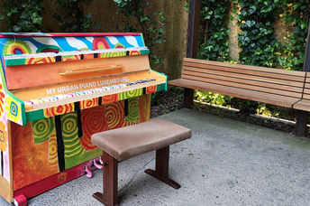 A piano in a park.