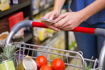 Woman shopping in supermarket.