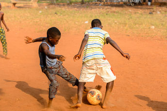 Children playing football.