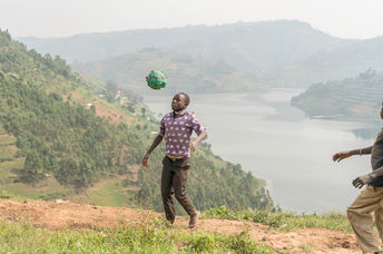 Playing with a homemade soccer ball.