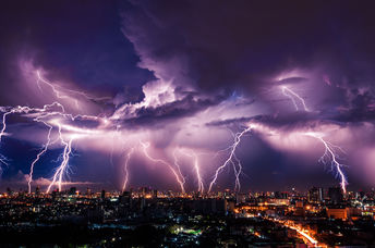 A lightning strike over a city.