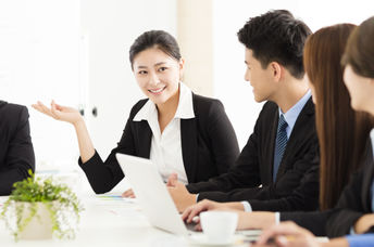Japanese workers at a meeting look happy and more refreshed, an outcome of a 4 day work week.