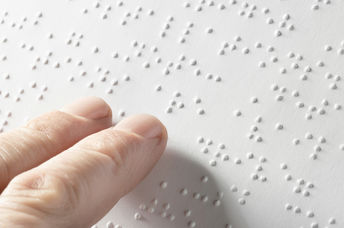 Blind person touching words.