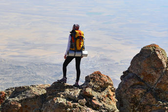 Self-confident woman makes it to the summit.