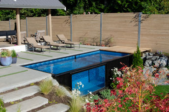 A home with a shipping container swimming pool.