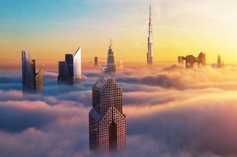 Dubai downtown at sunset covered with clouds