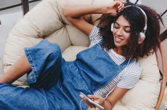 happy woman listening to an inspiring song.
