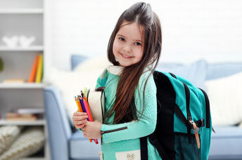 Little girl heading to her first day back at school