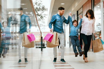 Happy family shopping in mall