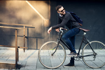 Cyclist heading to work in town center