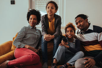 a family watching a movie together during Black History Month.