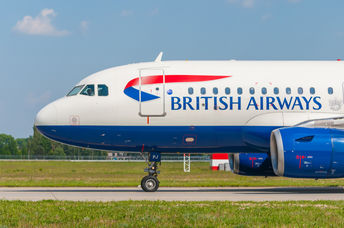 An airplane on the ground ready to roll.