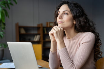 Woman distracted from her office work.