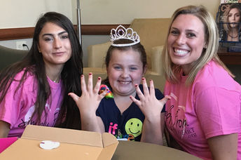 This patient is getting her nails done by the glam squad.
