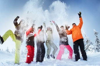 People in ski suits.