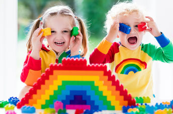 Kids playing with LEGO bricks.
