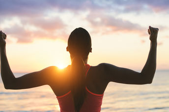 A woman celebrates success.