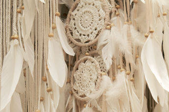 Knitted white dream catchers.