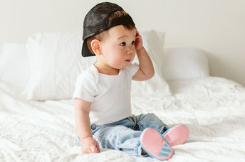 This baby is wearing Woolybobs newbie shoes.