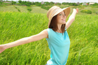 By being outdoors, a healthy woman is nurturing her skin microbiome.