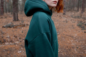 A woman wearing a hoodie.