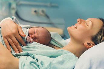 Newborn baby with mother