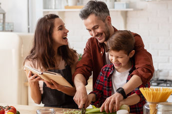 Family cooking a healthy meal.