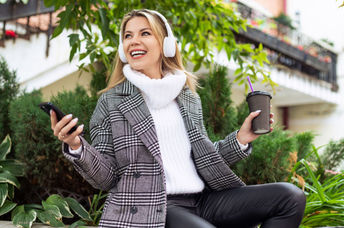 Taking a lunch break outside in a green space.