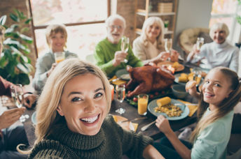 Family enjoying a traditional Thanksgiving feast.