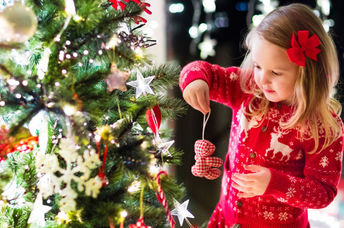 Trimming the tree for Christmas.