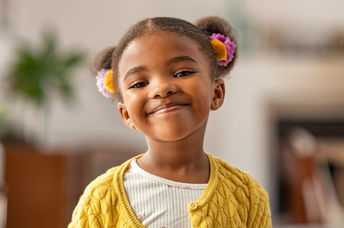 Smiling and self-confident cute little pupil.
