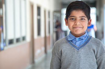 A little child with a uniform.