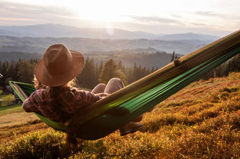 Resting on a hammock.