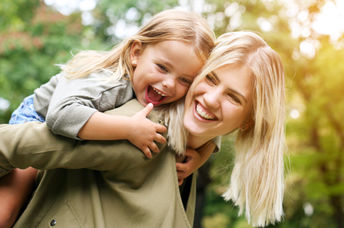 A young girl with her mother.
