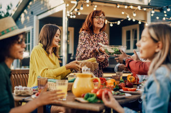 Family laughing and talking together at family gathering
