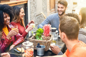 A group of friends enjoying a meal together at a restaurant.