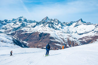 Sliding down on the snow.