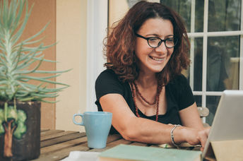 A woman studying at home .