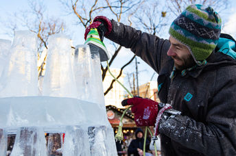 putting the finishing touches on an ice scupture.
