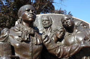 Statue of Harriet Tubman leading slaves to freedom in the north.